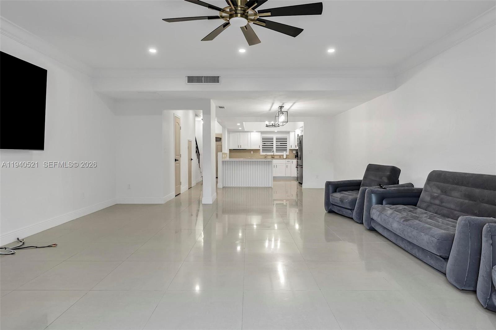 8898 Southwest 62nd Terrace, Unit 7F Miami, FL 33173 - Photo 37 of 66 a living room with furniture and a flat screen tv