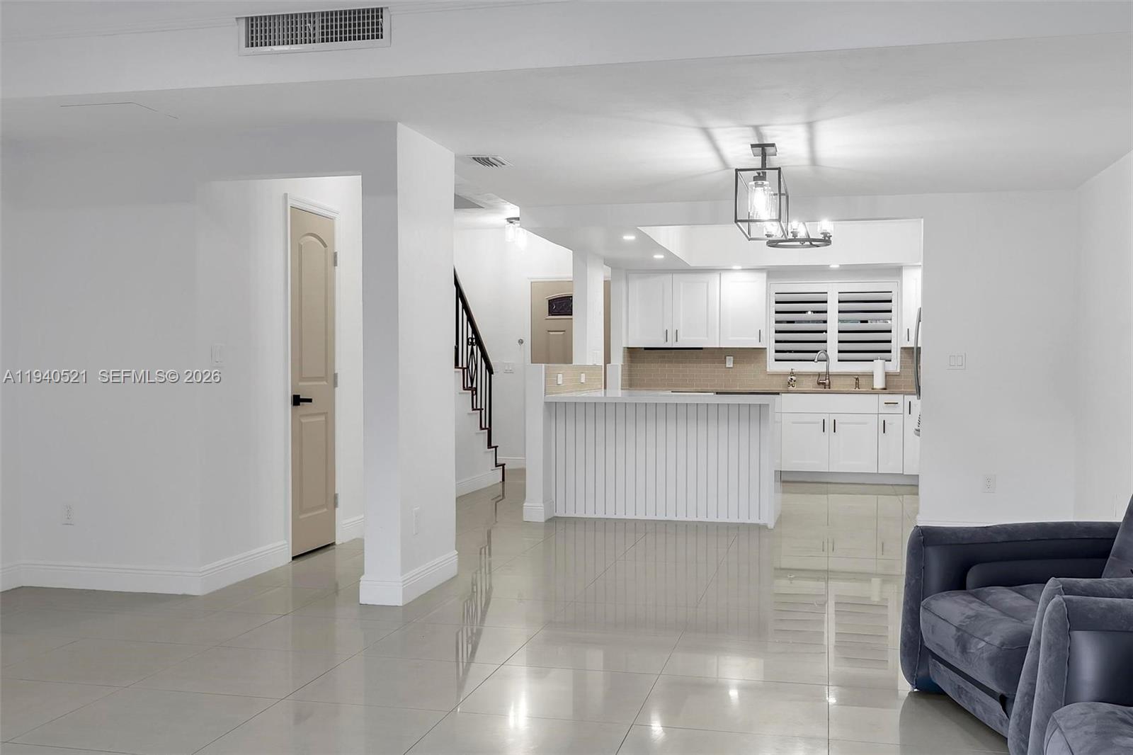 8898 Southwest 62nd Terrace, Unit 7F Miami, FL 33173 - Photo 39 of 66 a view of kitchen with furniture and wooden floor