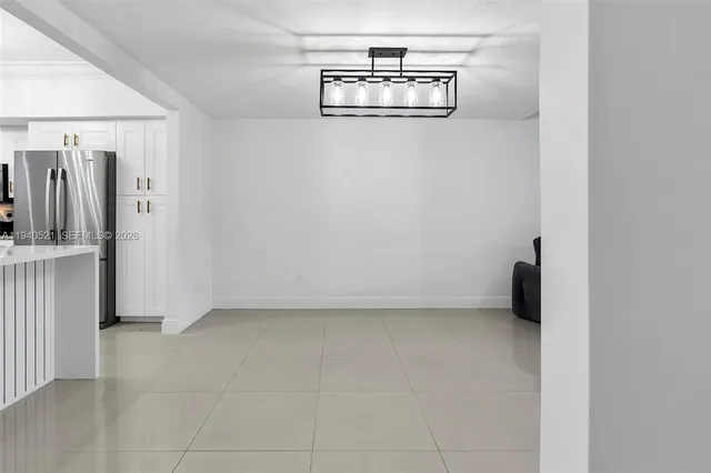 a view of room with wooden floor