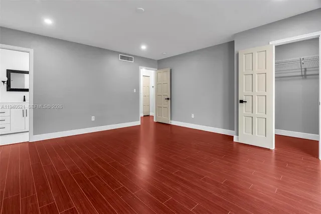 a view of a house with a tree in a yard