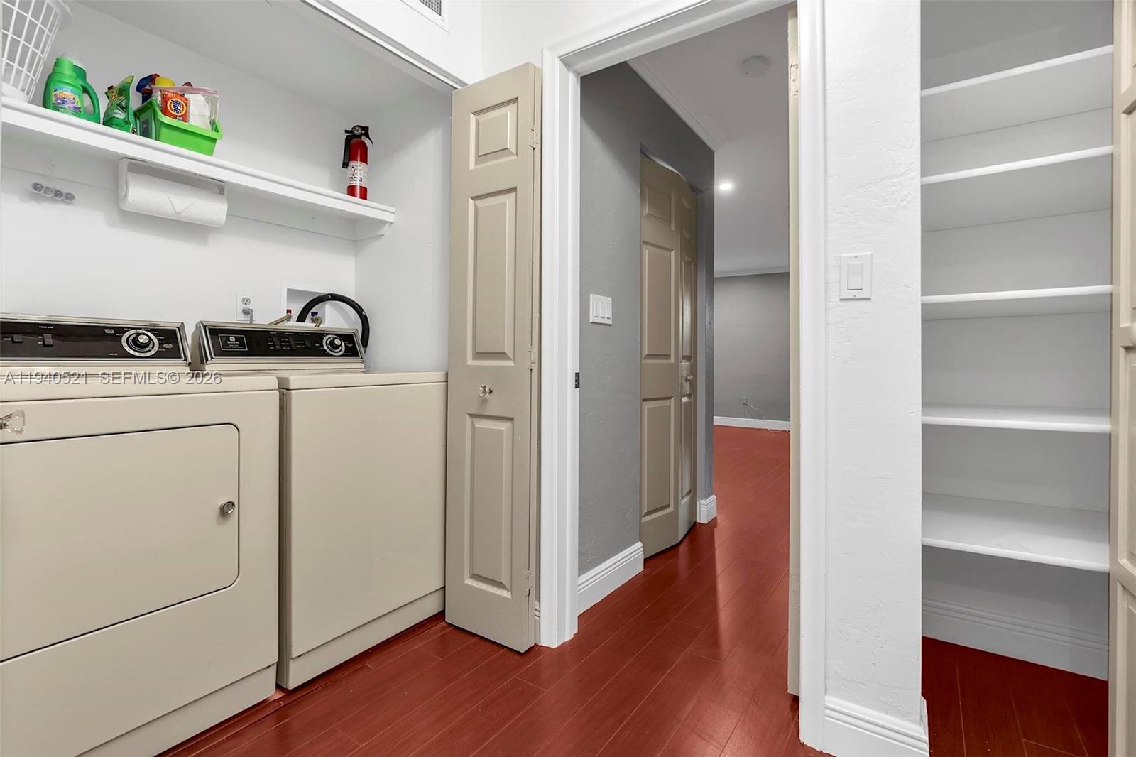 8898 Southwest 62nd Terrace, Unit 7F Miami, FL 33173 - Photo 52 of 66 a view of walk in closet with clothes and shoes