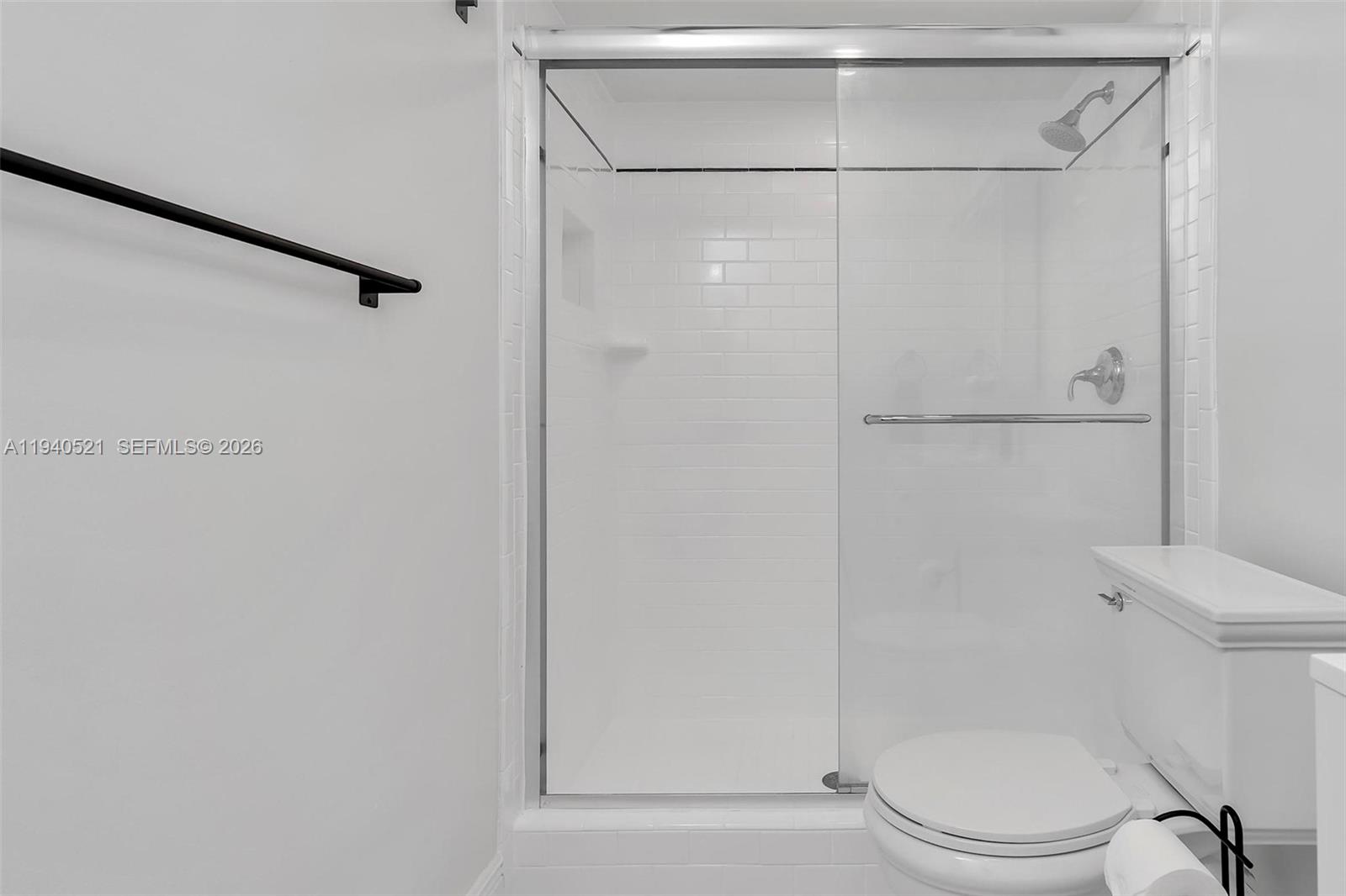 8898 Southwest 62nd Terrace, Unit 7F Miami, FL 33173 - Photo 60 of 66 a bathroom with a toilet and a shower