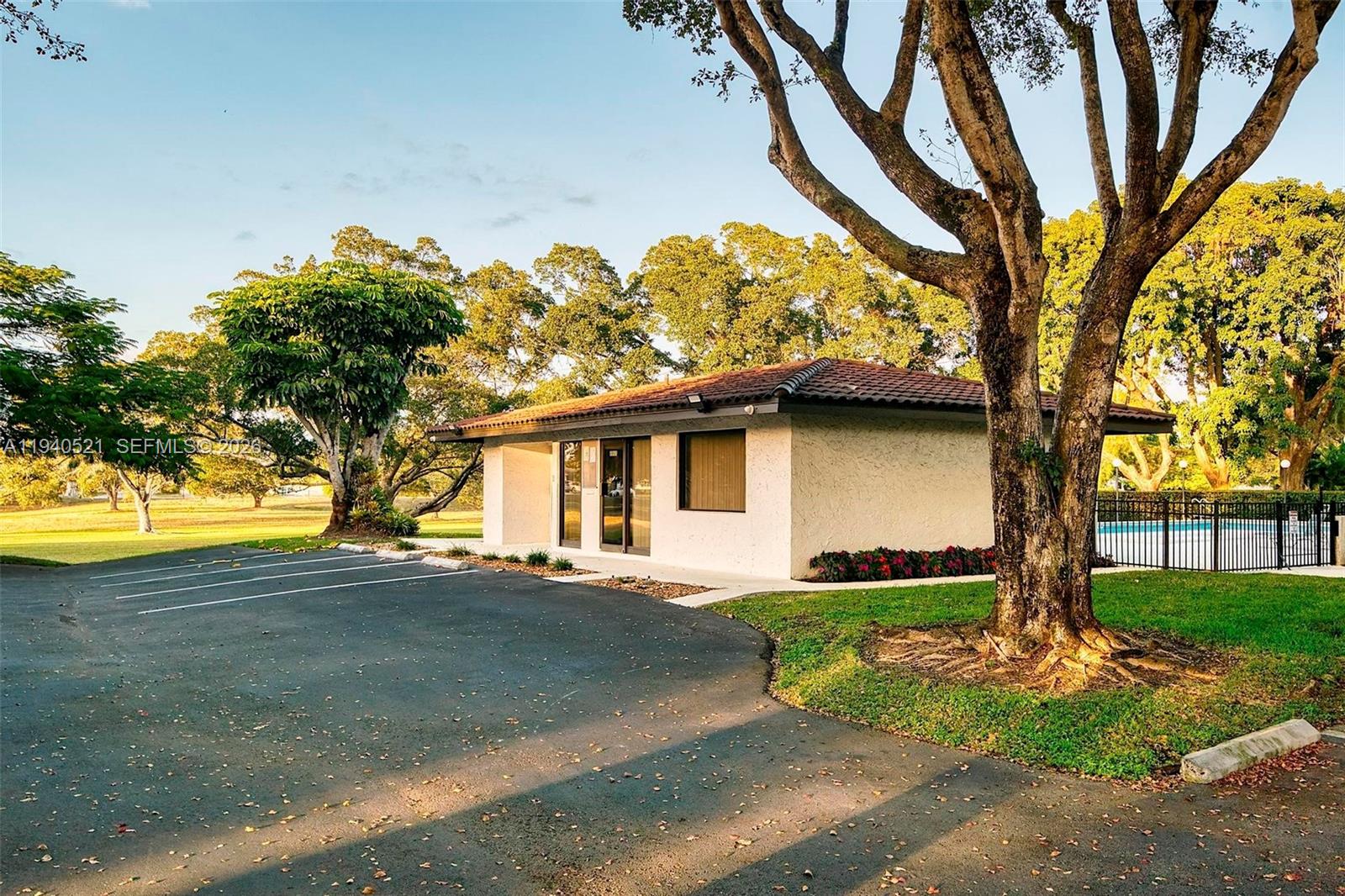 8898 Southwest 62nd Terrace, Unit 7F Miami, FL 33173 - Photo 62 of 66 a view of a house with a tree in a yard