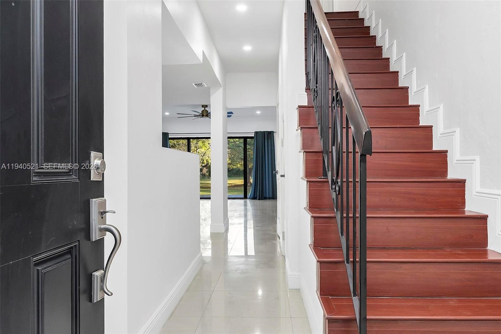 8898 Southwest 62nd Terrace, Unit 7F Miami, FL 33173 - Photo 10 of 66 a view of entryway and hall with wooden floor