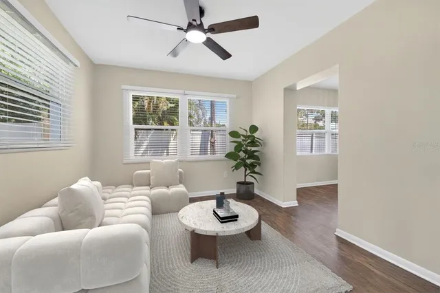a living room with furniture and a large window