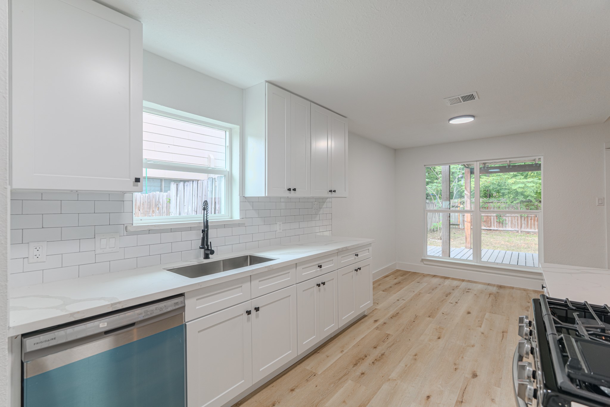 3702 Acorn Way Lane Spring, TX 77389 - Photo 18 of 38 a kitchen with a sink a window and cabinets