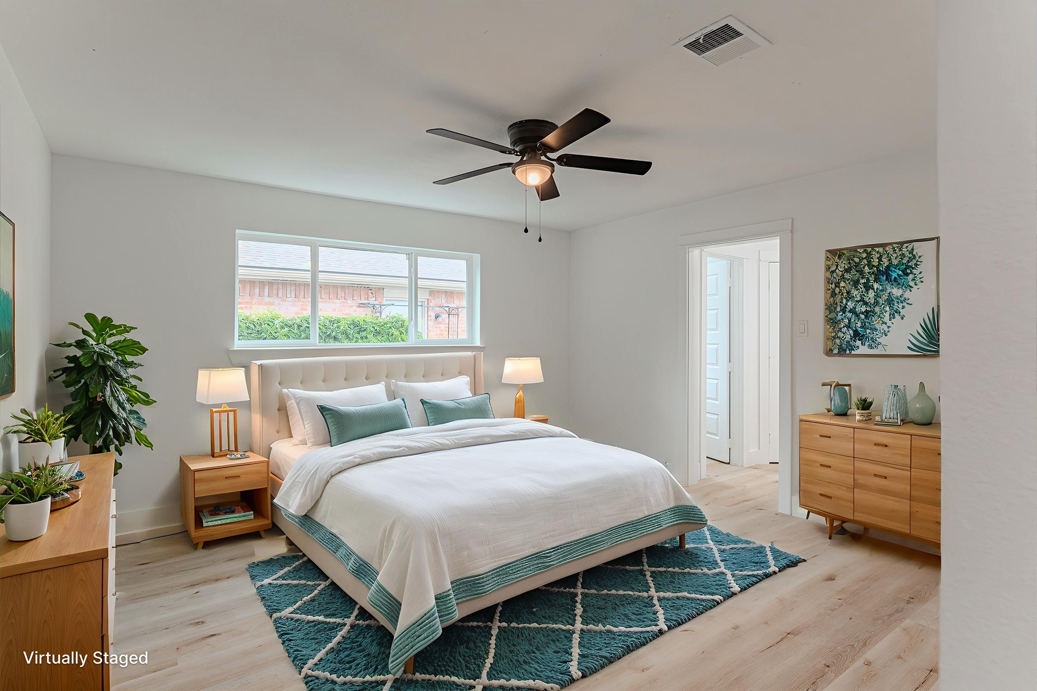 3702 Acorn Way Lane Spring, TX 77389 - Photo 20 of 38 a bedroom with a bed a dresser and potted plant