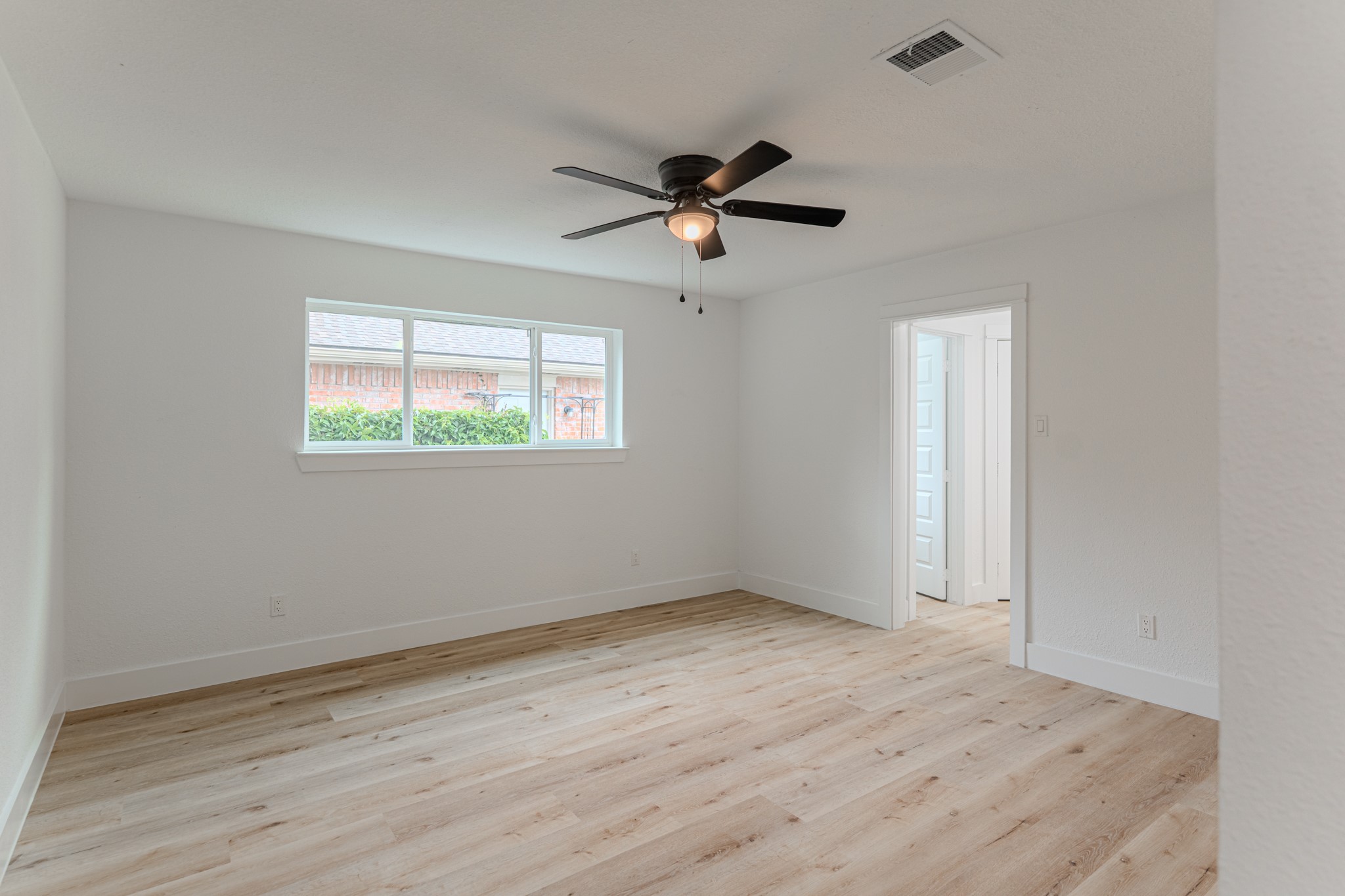 3702 Acorn Way Lane Spring, TX 77389 - Photo 21 of 38 an empty room with wooden floor ceiling fan and windows