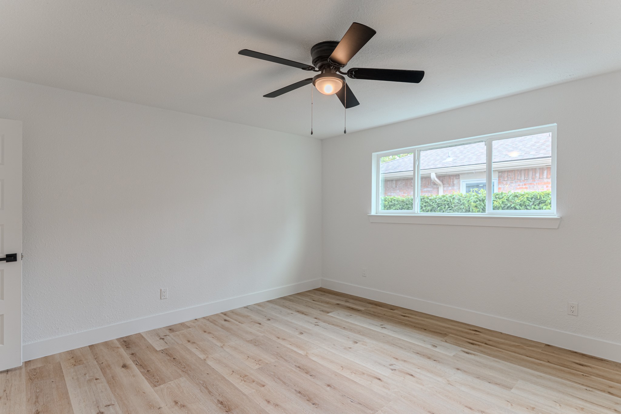 3702 Acorn Way Lane Spring, TX 77389 - Photo 23 of 38 wooden floor in an empty room with a window