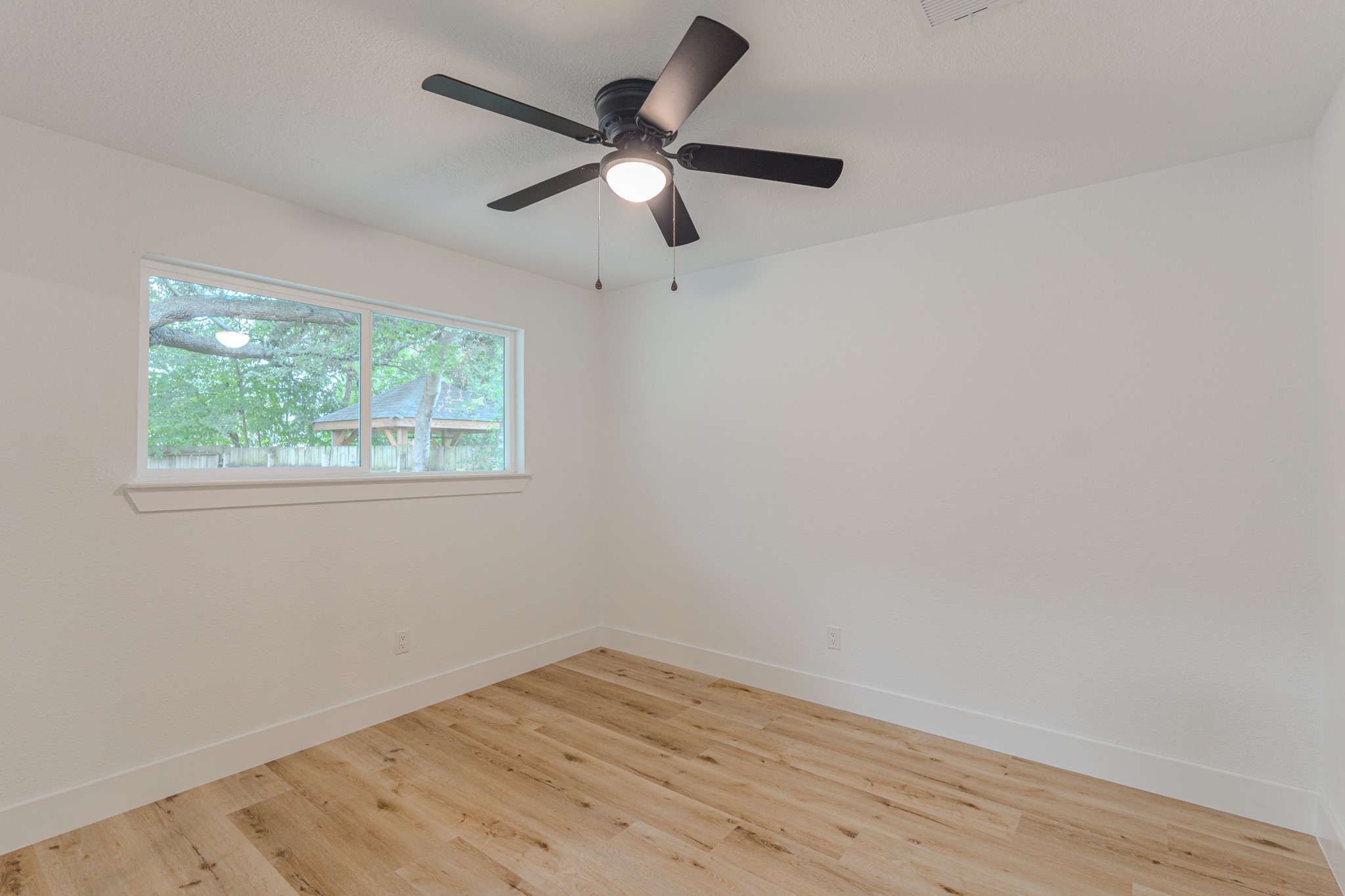 3702 Acorn Way Lane Spring, TX 77389 - Photo 29 of 38 an empty room with wooden floor and windows