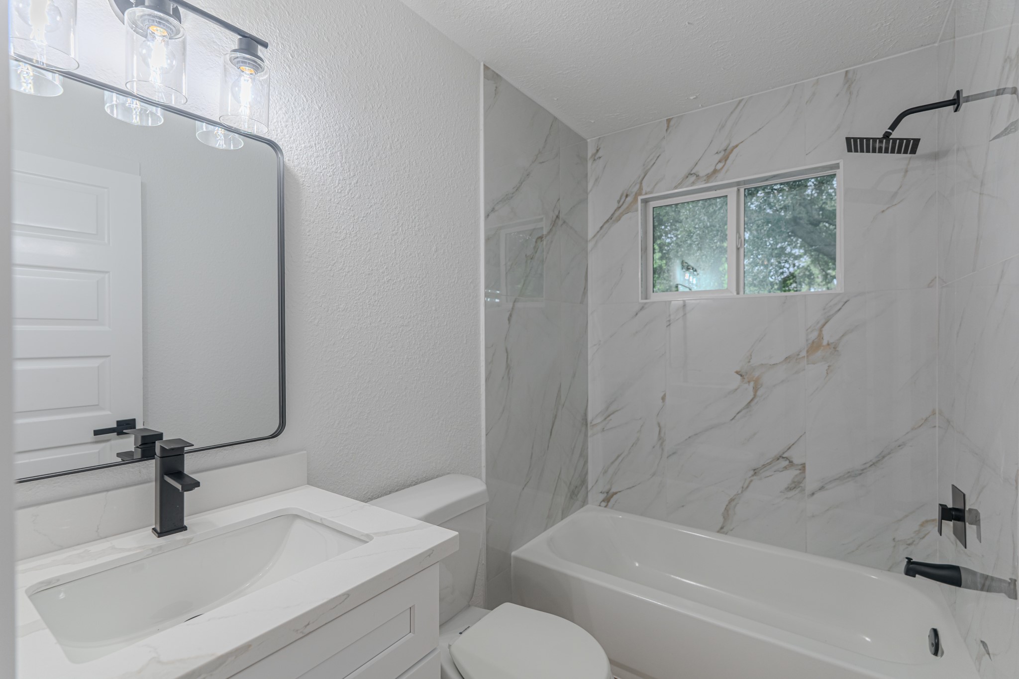 3702 Acorn Way Lane Spring, TX 77389 - Photo 31 of 38 a bathroom with a sink a toilet and a bathtub