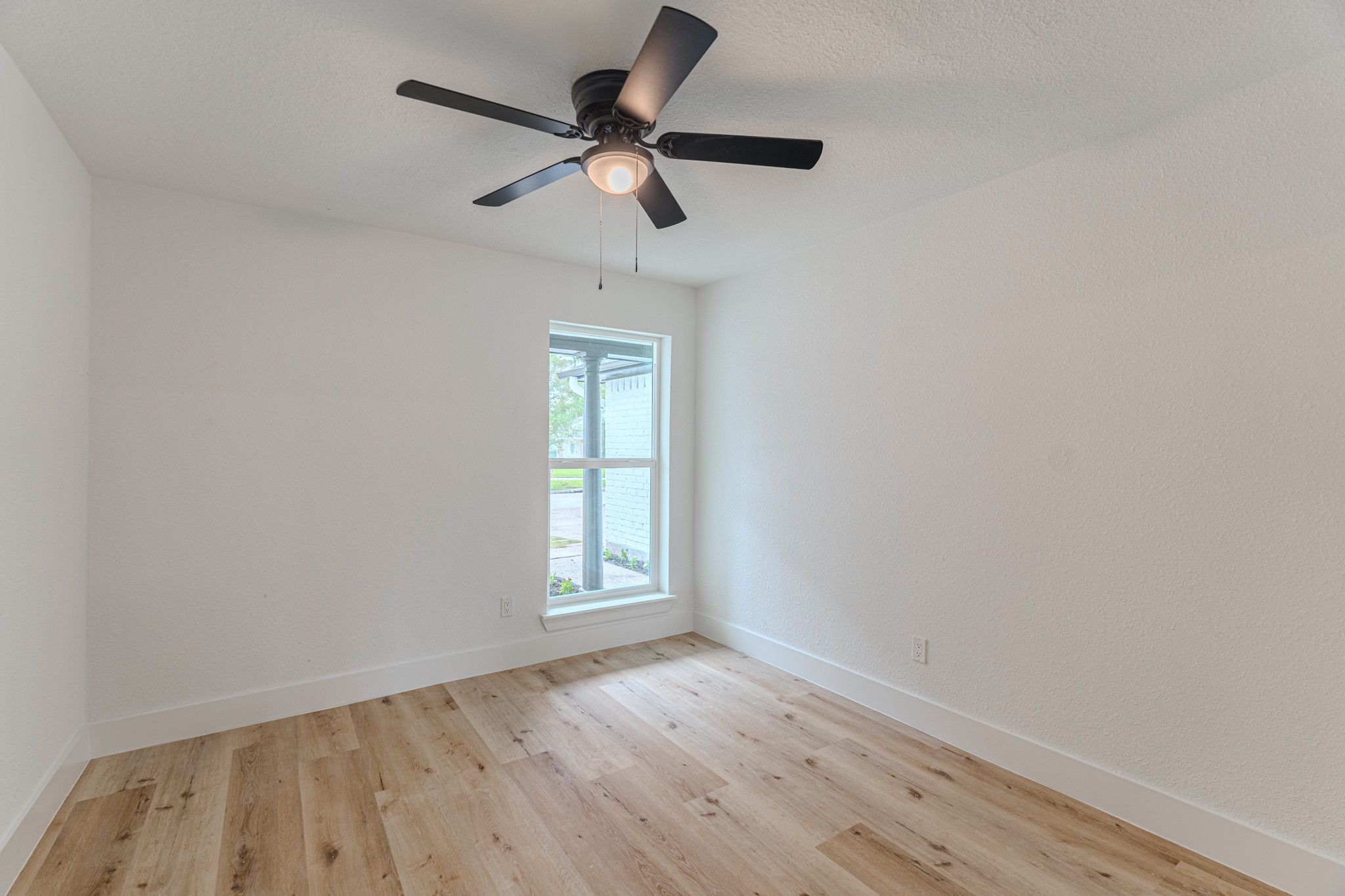 3702 Acorn Way Lane Spring, TX 77389 - Photo 32 of 38 an empty room with wooden floor fan and windows