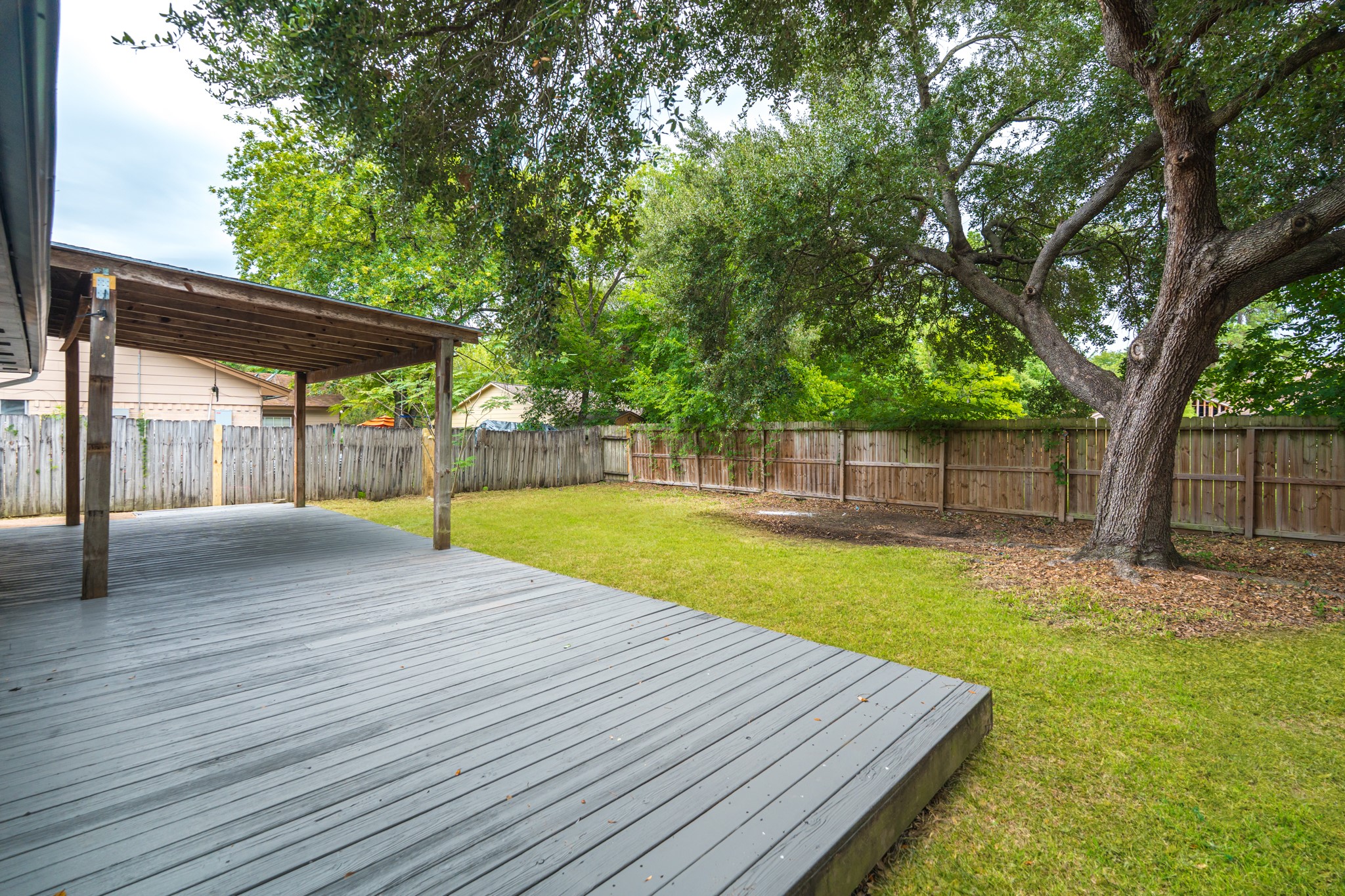 3702 Acorn Way Lane Spring, TX 77389 - Photo 37 of 38 a view of a backyard with a garden and trees