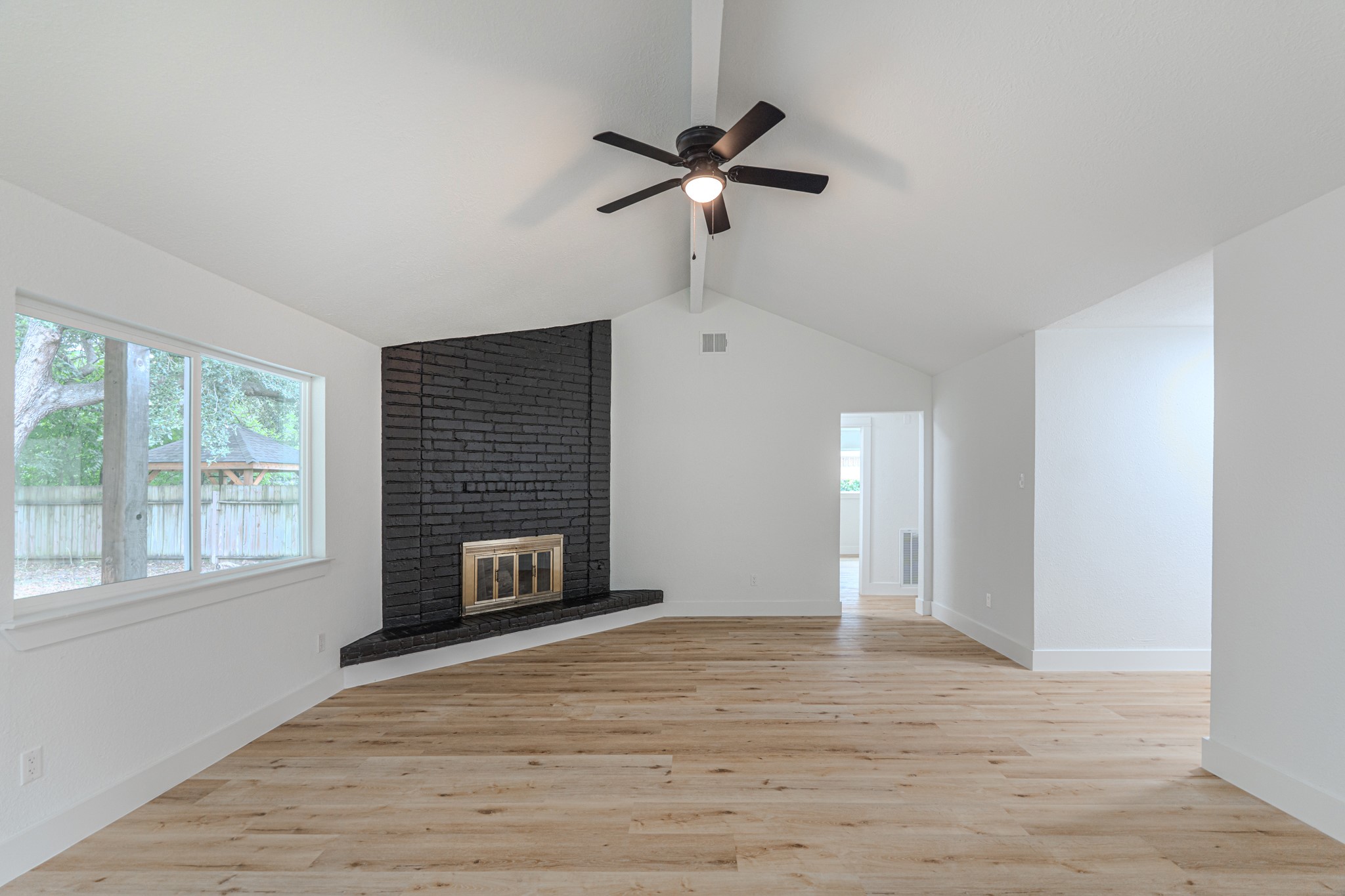 3702 Acorn Way Lane Spring, TX 77389 - Photo 7 of 38 a view of an empty room with a window and wooden floor