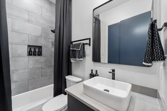 a bed sitting in a room next to a window