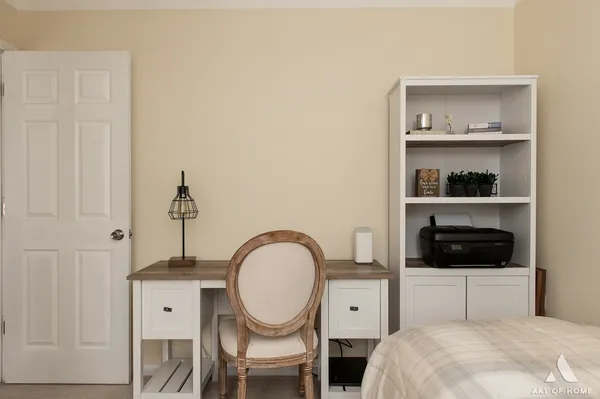 a spacious bedroom with a bed and cabinets