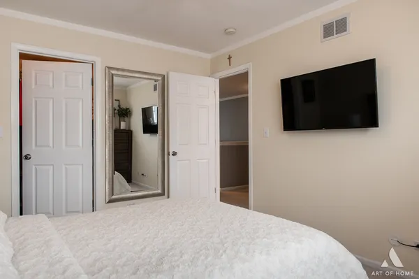 a bedroom with a flat screen tv
