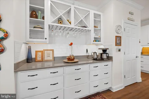 a kitchen with cabinets and window