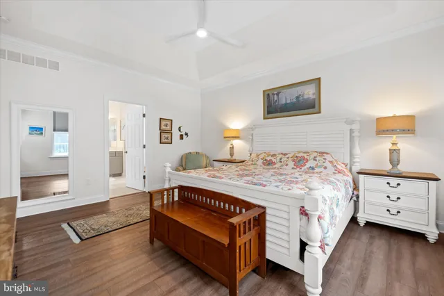 a bedroom with a bed and a night stand