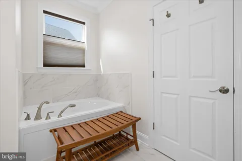a bathroom with a bathtub and a sink