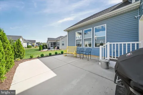 a view of porch with a bench