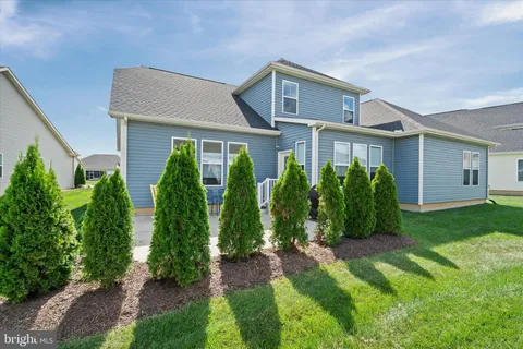 front view of a house with a garden