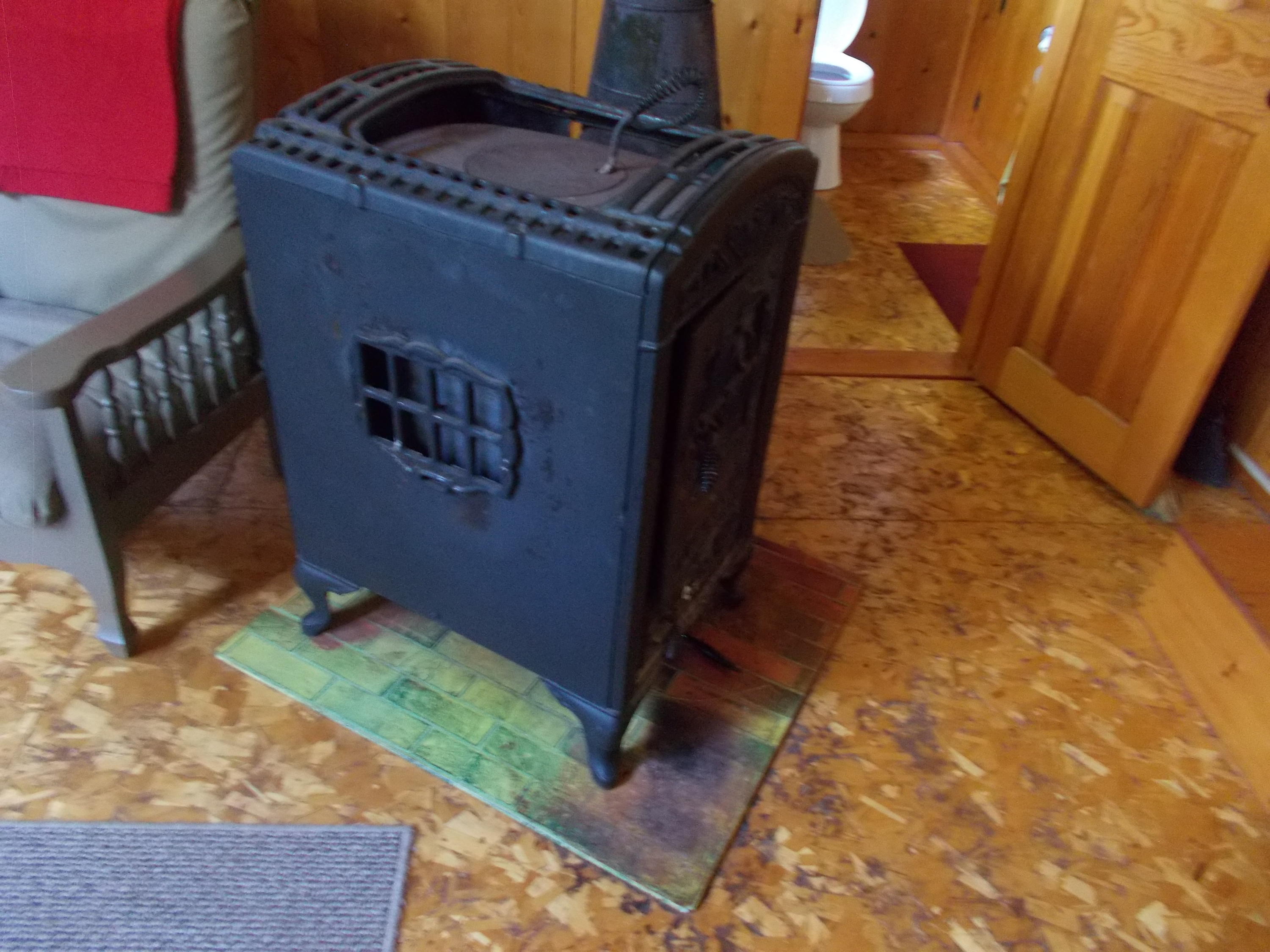 72 Puckerbrush Trail Millinocket, ME 04462 - Photo 36 of 48 Wood stove in main cottage
