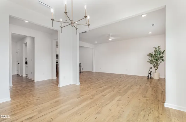 a view of kitchen with microwave and cabinets