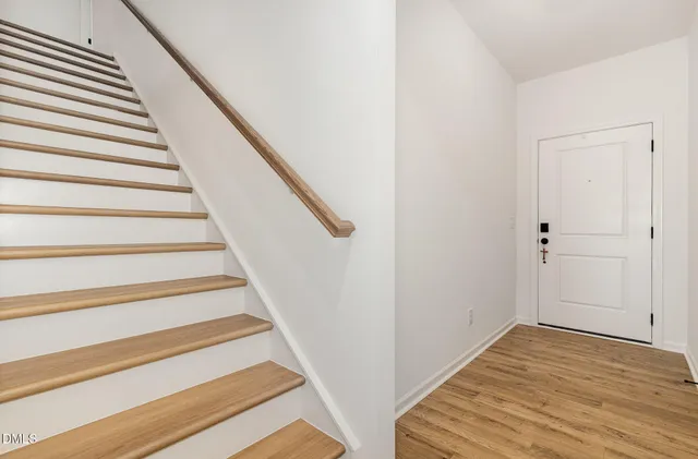 a picture of a bench in front of a wall