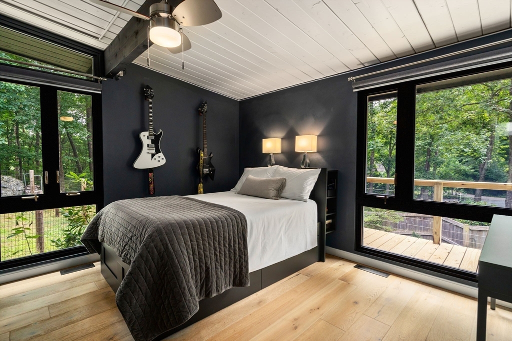 5 Apple Street Sherborn, MA 01770 - Photo 18 of 36 a bedroom with a large bed and a large window