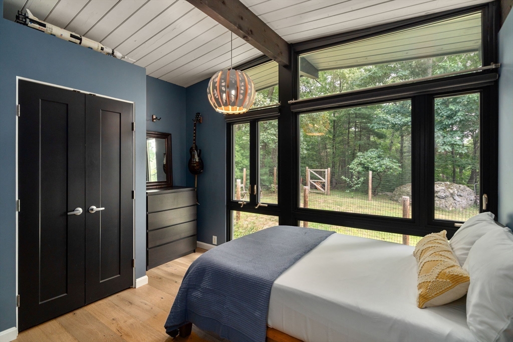 5 Apple Street Sherborn, MA 01770 - Photo 19 of 36 a bedroom with a bed and a large window