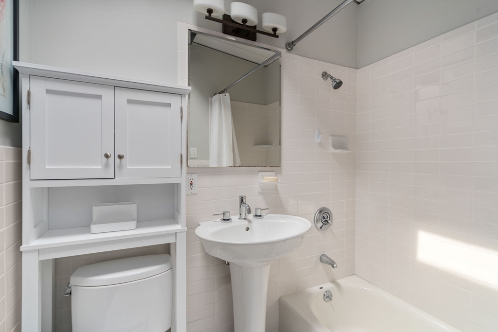 5 Apple Street Sherborn, MA 01770 - Photo 20 of 36 a bathroom with a sink a mirror and a bathtub