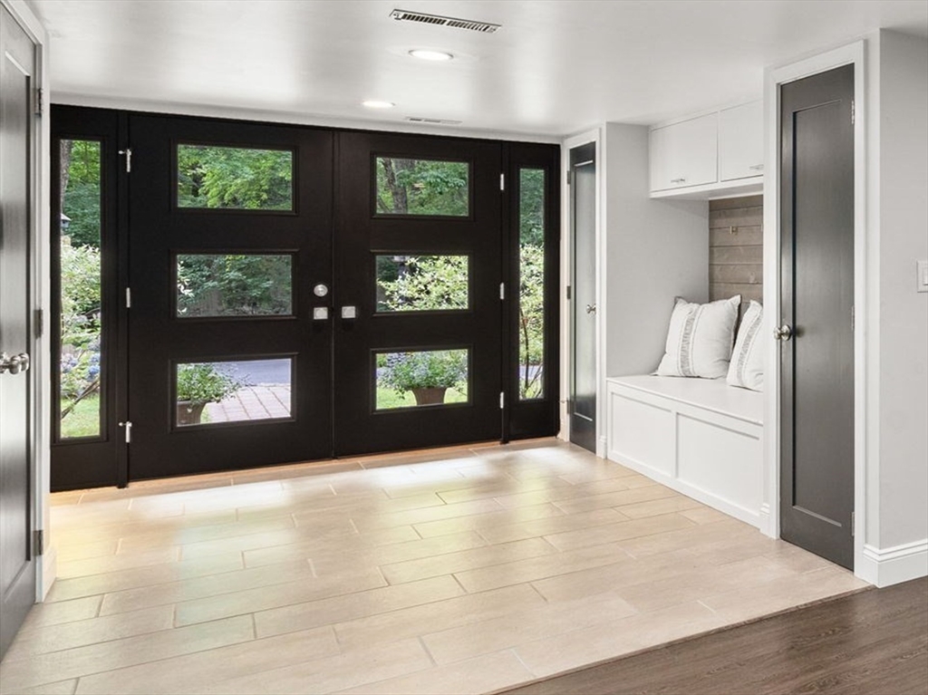 5 Apple Street Sherborn, MA 01770 - Photo 2 of 36 a living room with a large window and fireplace