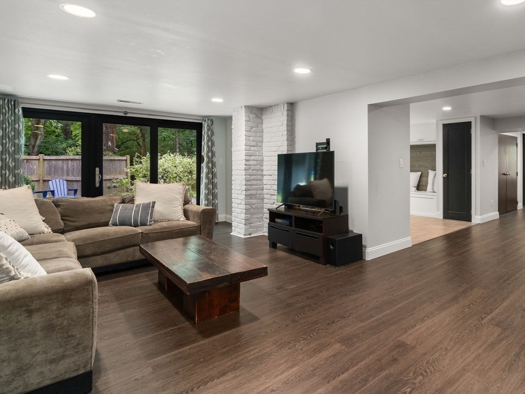 5 Apple Street Sherborn, MA 01770 - Photo 22 of 36 a living room with furniture flat screen tv and a large window