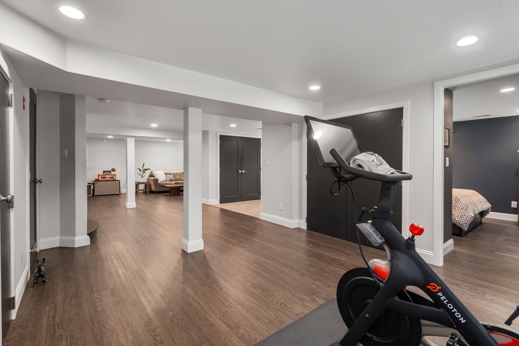 5 Apple Street Sherborn, MA 01770 - Photo 25 of 36 a view of a hallway with wooden floor and furniture