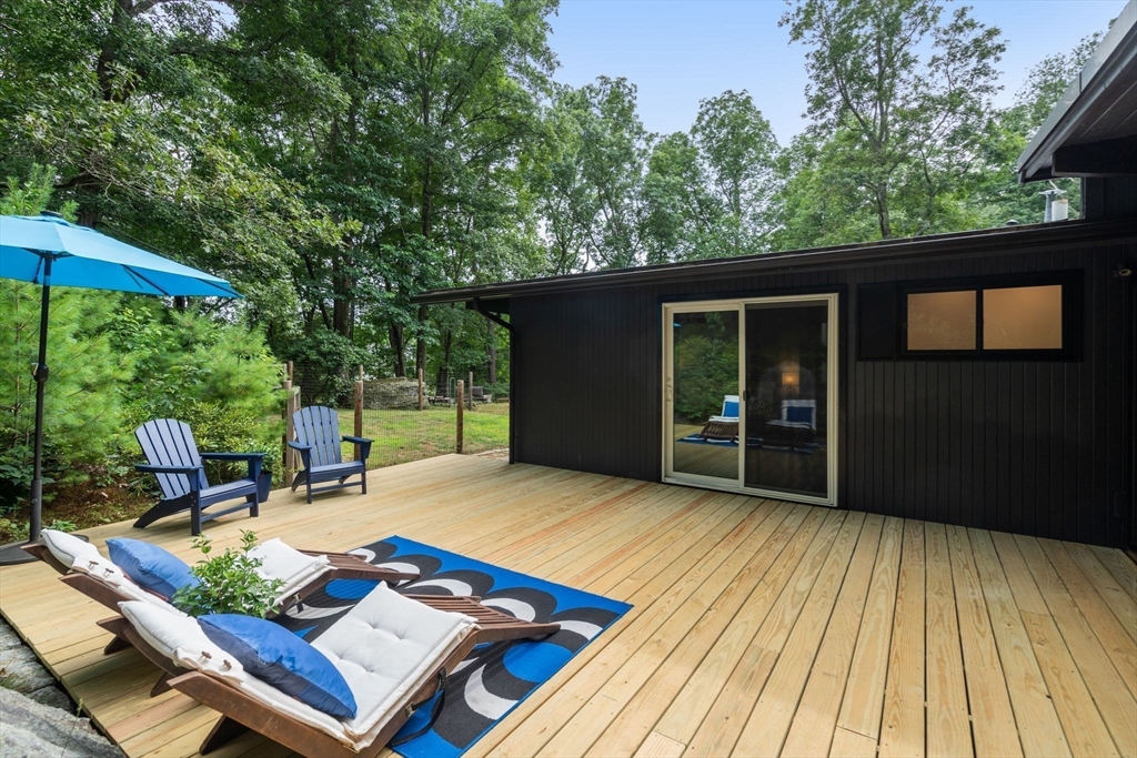 5 Apple Street Sherborn, MA 01770 - Photo 28 of 36 a view of backyard with a patio and wooden floor