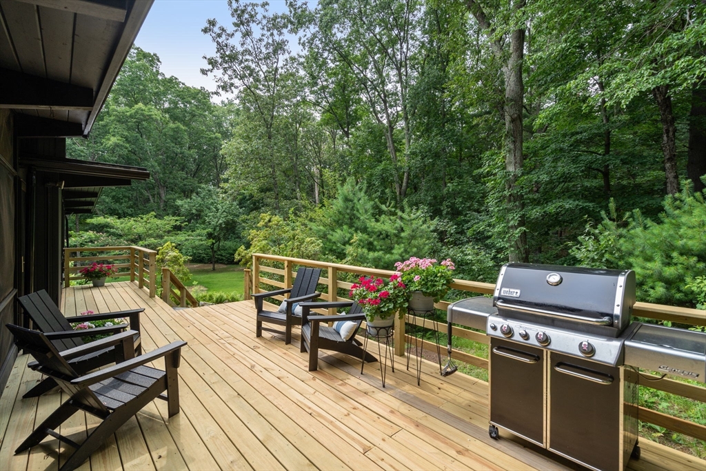 5 Apple Street Sherborn, MA 01770 - Photo 30 of 36 a view of a chairs and table on the wooden deck