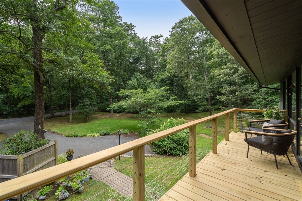 5 Apple Street Sherborn, MA 01770 - Photo 32 of 36 a view of a balcony with wooden floor and fence