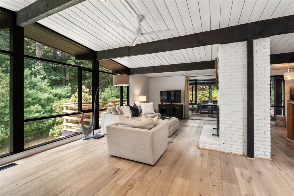 5 Apple Street Sherborn, MA 01770 - Photo 9 of 36 a living room with furniture and large windows