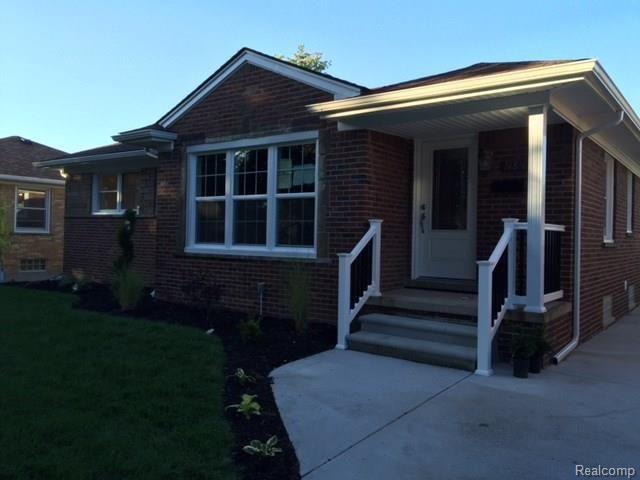 new landscaping and porch railings with pillar