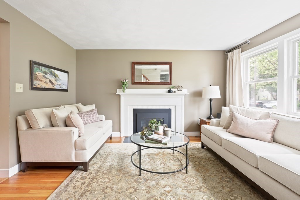 18 Moore Street Natick, MA 01760 - Photo 15 of 42 a living room with furniture and a fireplace