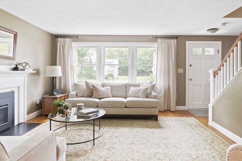 18 Moore Street Natick, MA 01760 - Photo 16 of 42 a living room with furniture and a fireplace