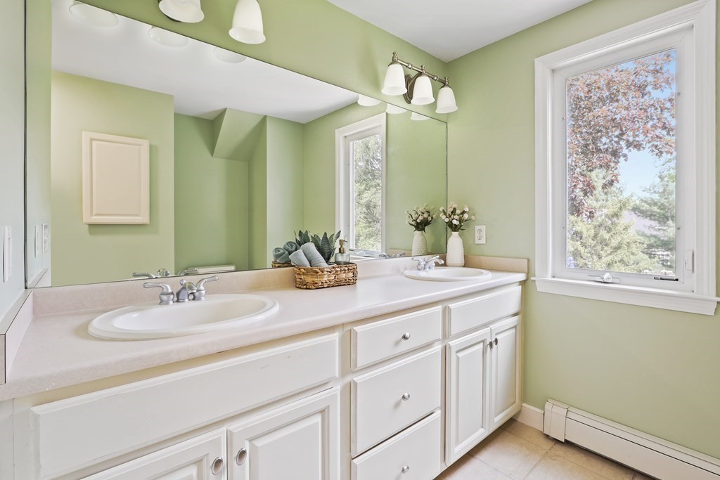 18 Moore Street Natick, MA 01760 - Photo 26 of 42 a bathroom with a sink and a mirror