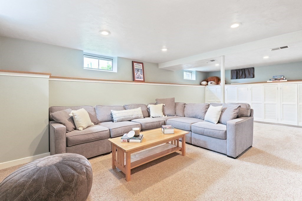 18 Moore Street Natick, MA 01760 - Photo 28 of 42 a living room with furniture and a large window