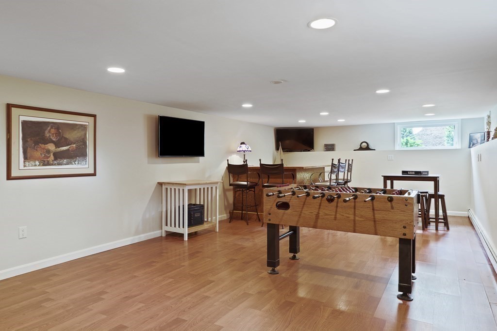 18 Moore Street Natick, MA 01760 - Photo 30 of 42 a living room with lots of furniture and a flat screen tv
