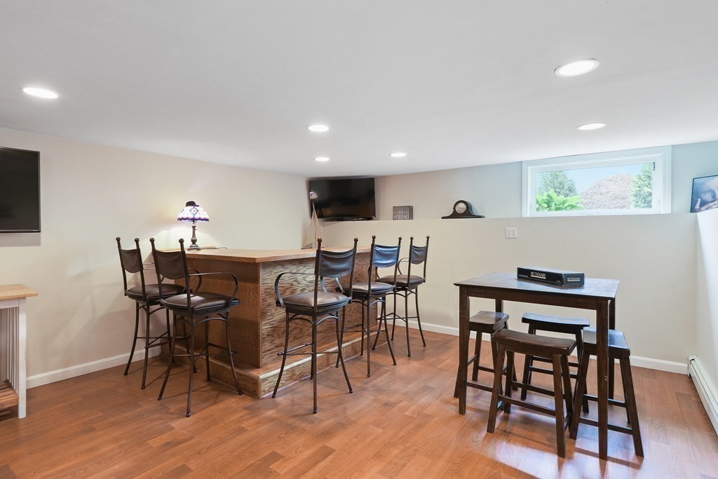 18 Moore Street Natick, MA 01760 - Photo 31 of 42 a view of a dining room with furniture and wooden floor