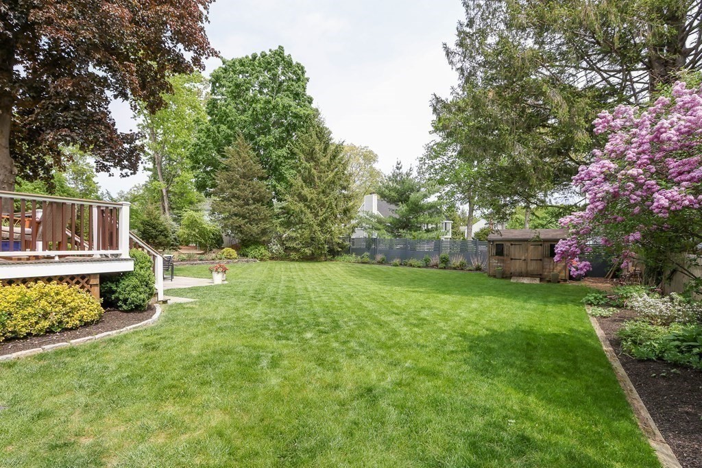 18 Moore Street Natick, MA 01760 - Photo 32 of 42 a backyard of a house with lots of green space