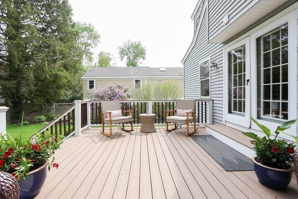 18 Moore Street Natick, MA 01760 - Photo 40 of 42 a view of a balcony with chairs and wooden floor