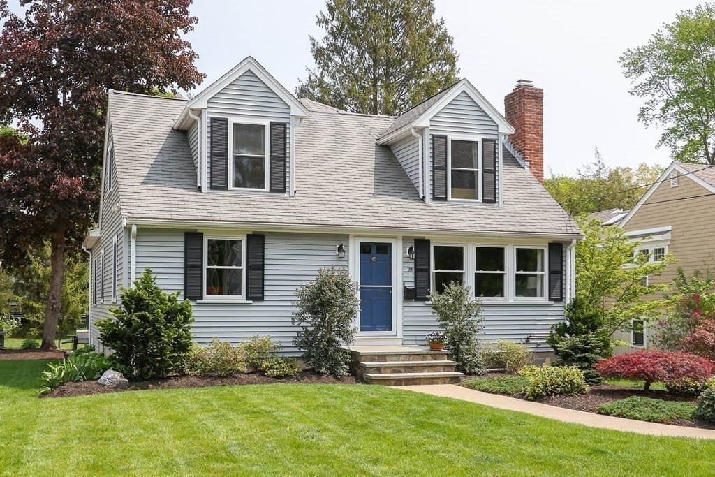 18 Moore Street Natick, MA 01760 - Photo 41 of 42 a front view of a house with a yard and garage