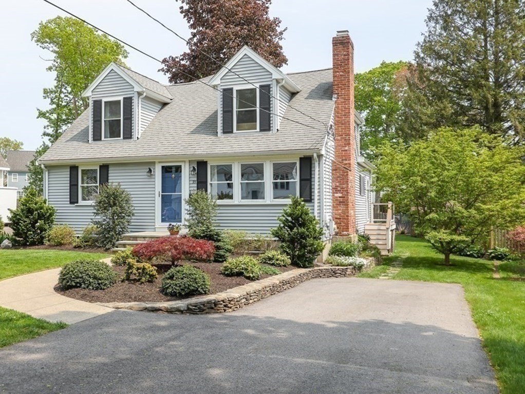 18 Moore Street Natick, MA 01760 - Photo 6 of 42 front view of a house with a yard